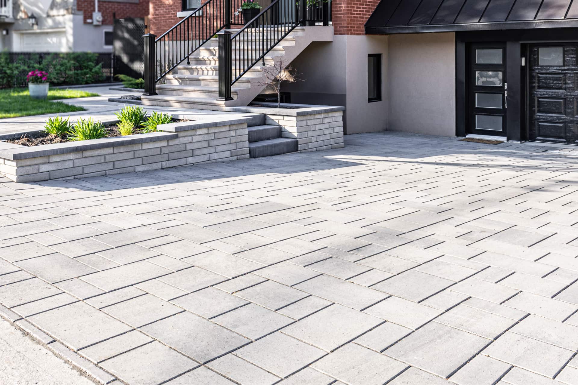 A newly paved residential driveway finished with interlocking paving stones