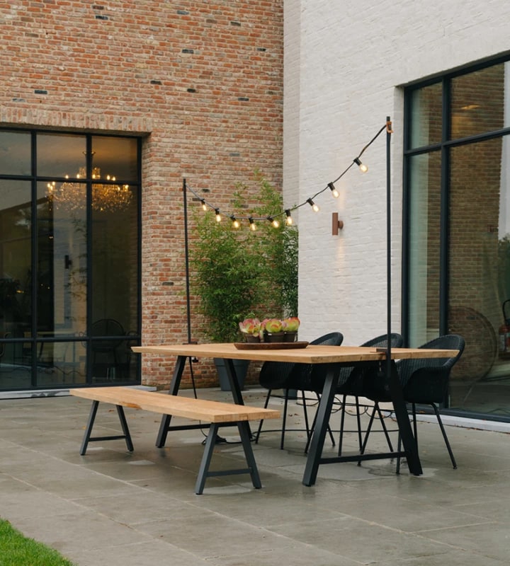 Smooth concrete paving with minimalist table and chairs. Credit to Vincent Sheppard