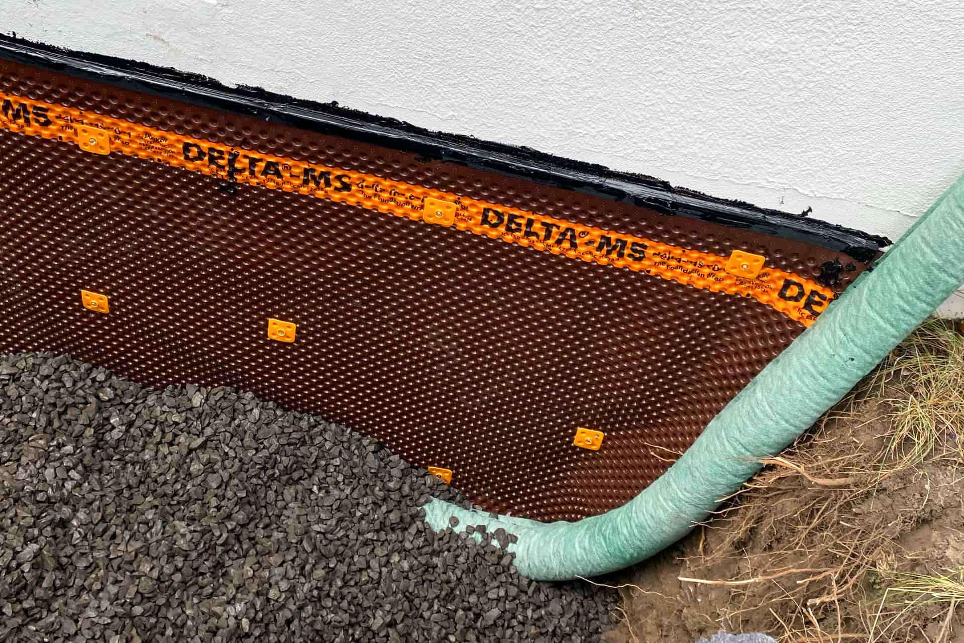 Foundation waterproofing membrane with French drain installation by professional French drain contractors in Montreal.
